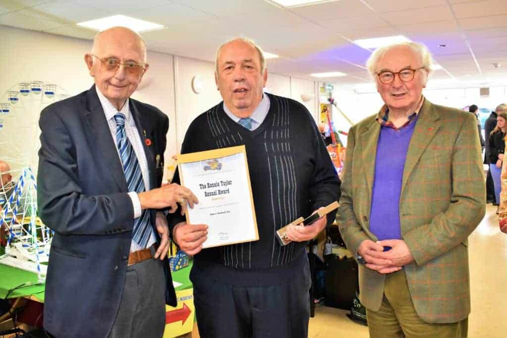 Photo - Albert Holland Snr collects the award at the Loughborough Fair model show from FAGB president Anthony Harris (left) and chairman Graham Downie (right). Photo David Springthorpe