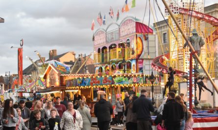 Photo - Oliver Cromwell overlooks part of the Market Hill section of St Ives Michaelmas Fair.