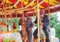 photo of Mayor of Sandwell Cllr Richard Jones and consort Cllr Richard McVittie on the Gallopers at Pat Collins Funfair for Select Lifestyles’ free funfair day out.