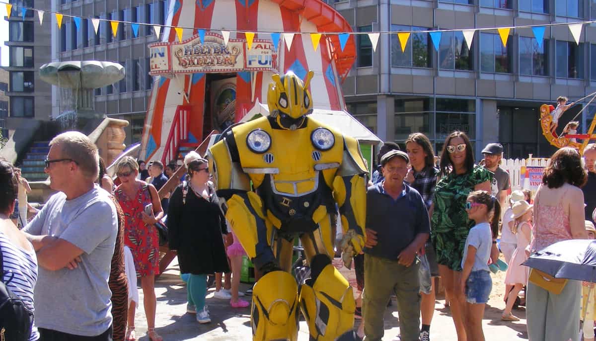 A bumble bee joins children enjoying the beach and funfair attractions at Sheffield by the Seaside.
