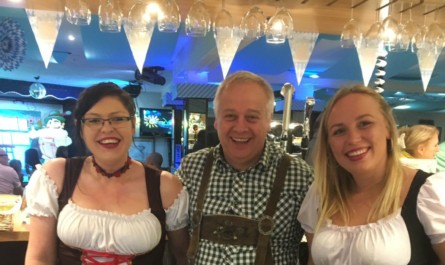 Dean Deakin with two of the bar staff at the Octoberfest event at Sunnyvale.