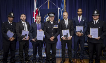 Patrick Hill receives his Chief Constable’s Commendation certificate alongside the two police officers and security guards for their bravery in apprehending two violent men. Photo: West Midlands Police