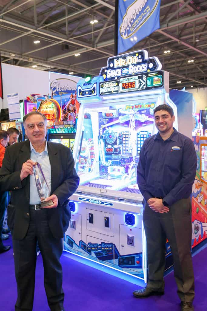 John Stergides Snr and John Anthony Stergides on Electrocoin’s stand at EAG 2023, when John Stergides was presented with an achievement award. Photo: EAG