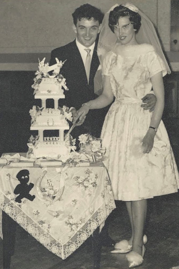 Cutting the cake: On their wedding day on 6 February 1964, Charles and Irene Thomas cut their wedding cake.