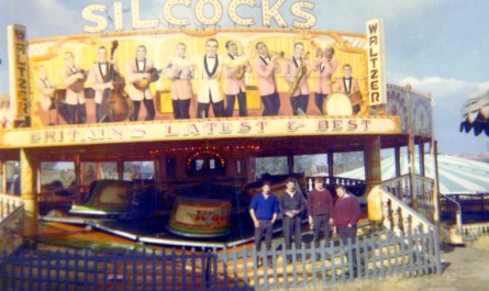 Ted Silcock’s Maxwell waltzer with men painting the run-ups.
