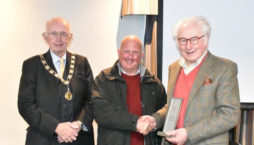 FAGB Chairman Graham Downie presents the Ronnie Taylor award to Anthony Harris Jnr for his contribution to the business and the presentation of his equipment, watched by Walsall Deputy Mayor Cllr Anthony Harris Snr.